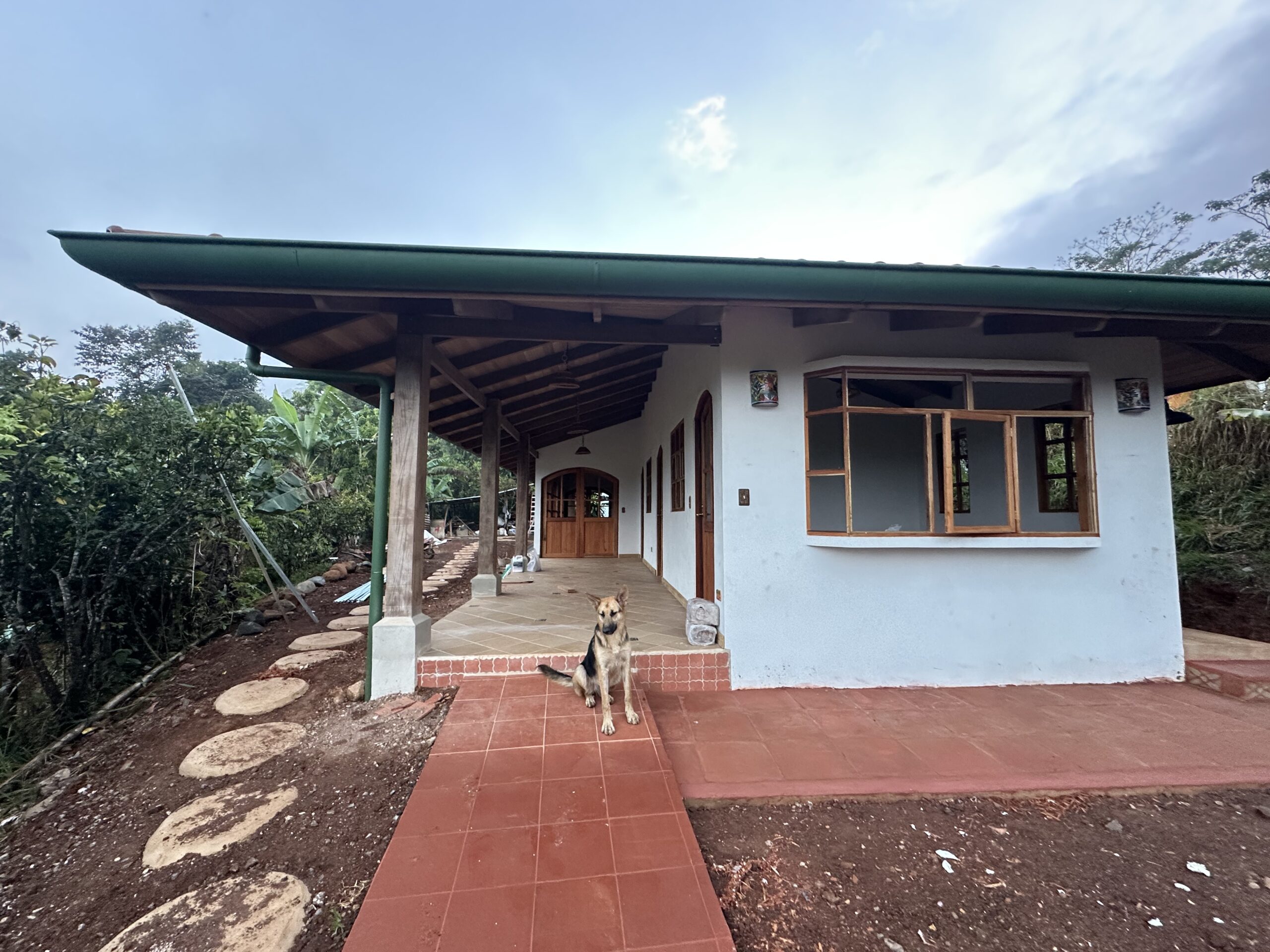 Finished colonial-inspired home with a deep covered veranda in Puriscal