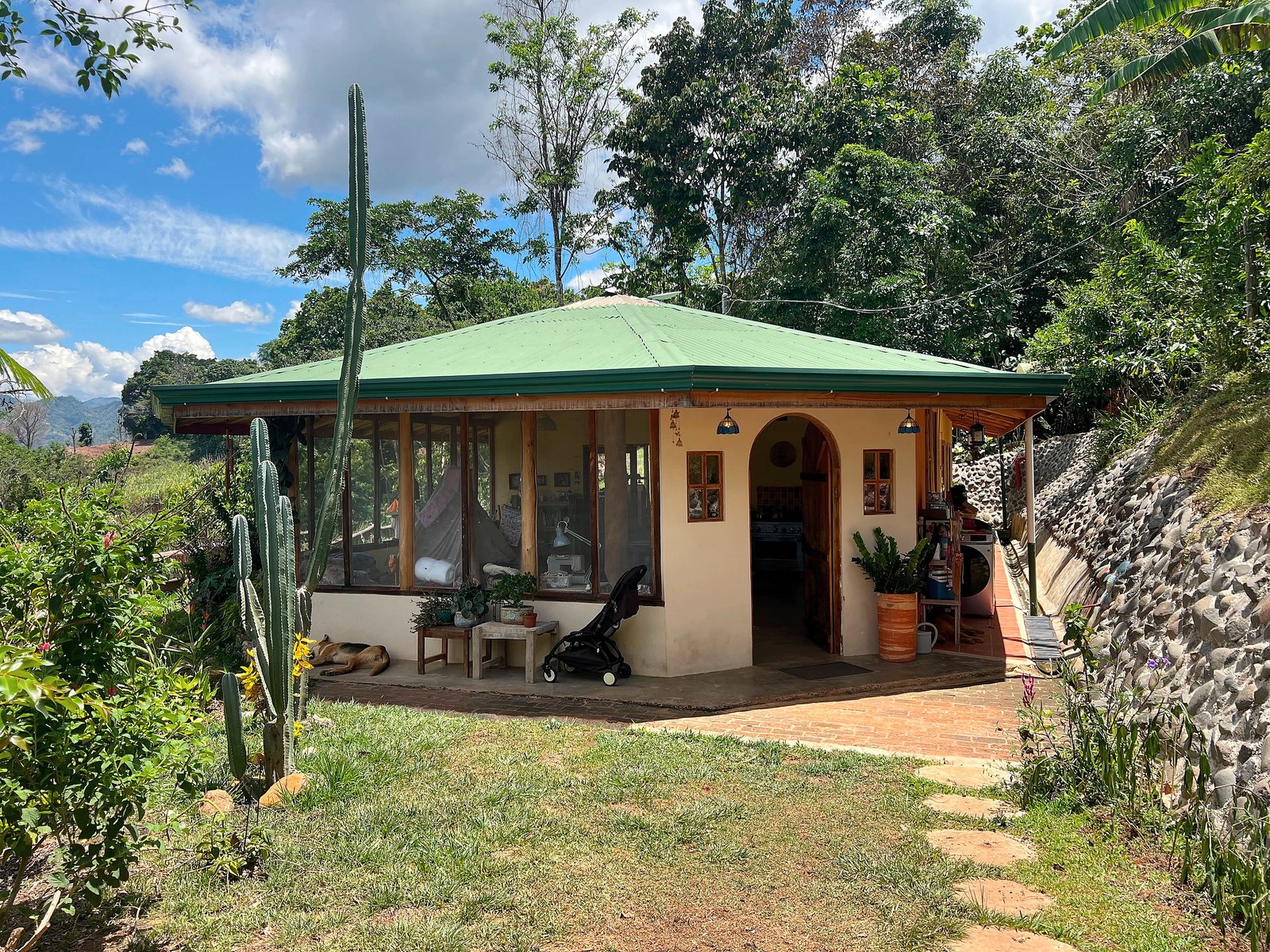 Completed Timber House surrounded by a tropical garden in Puriscal