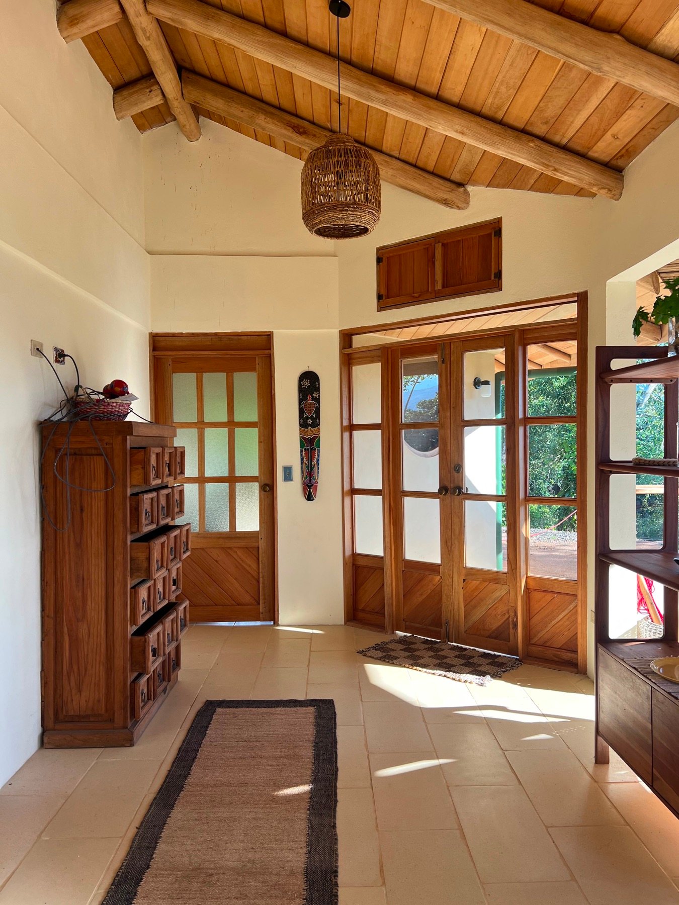 Handcrafted timber entry at the Round Window Home in Puriscal